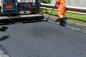 Residential paving. Asphalt Surface Improvement Work With Road Paving Machines.